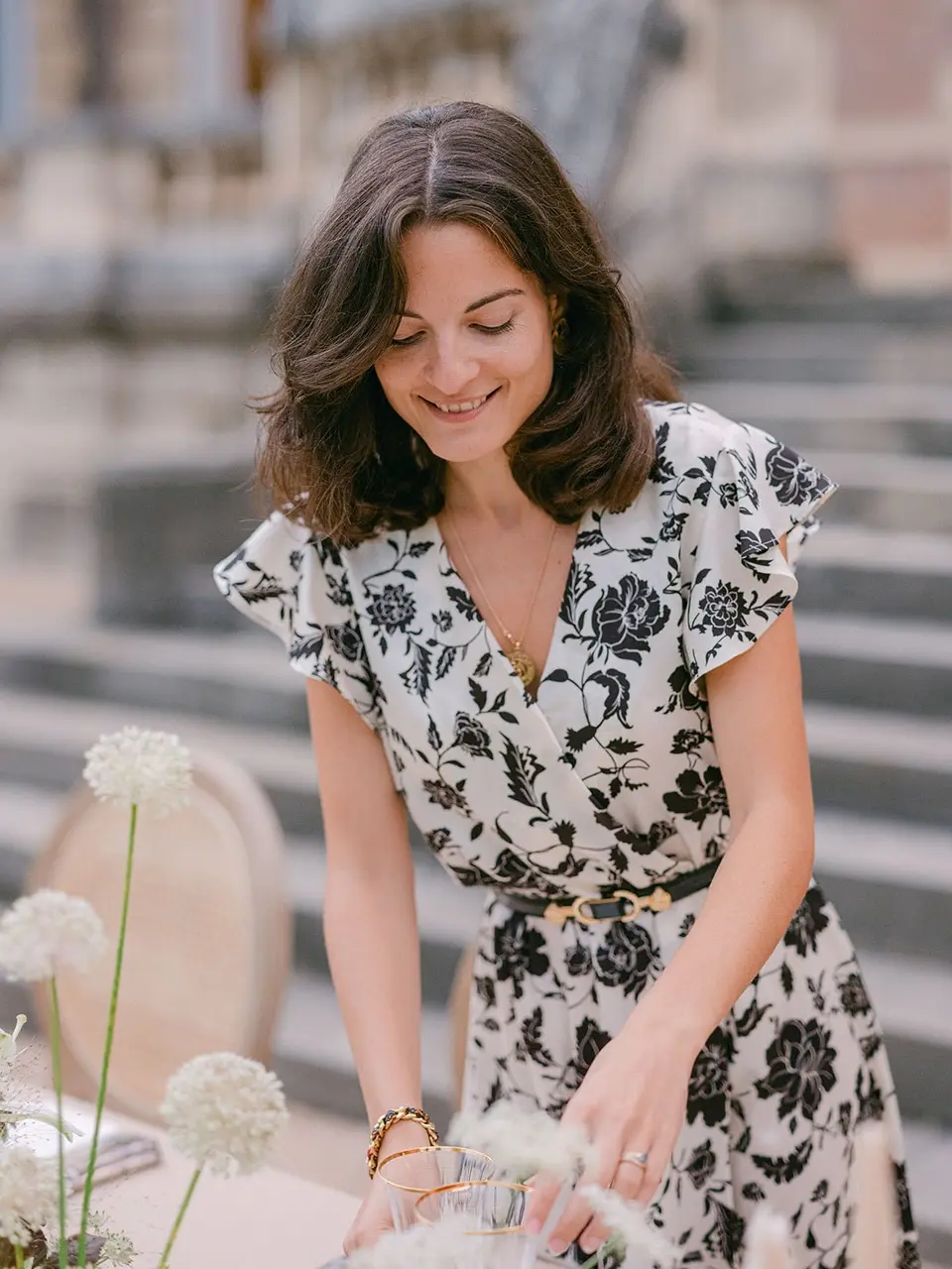 Julie Nagy styling a wedding table at a French château